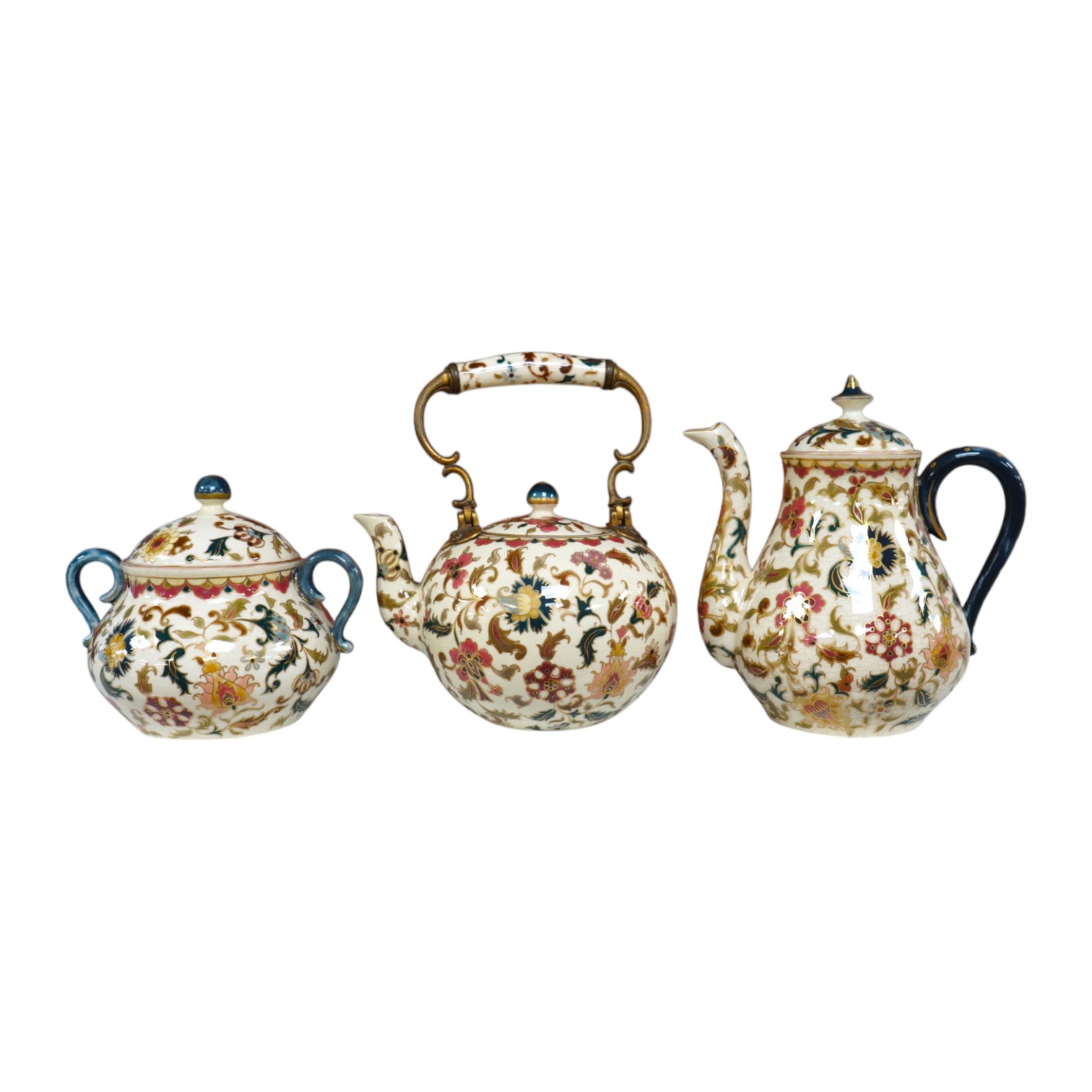 A matched Hungarian Zsolnay floral three piece tea set, largest 17cm high. Condition - fair, crazing throughout